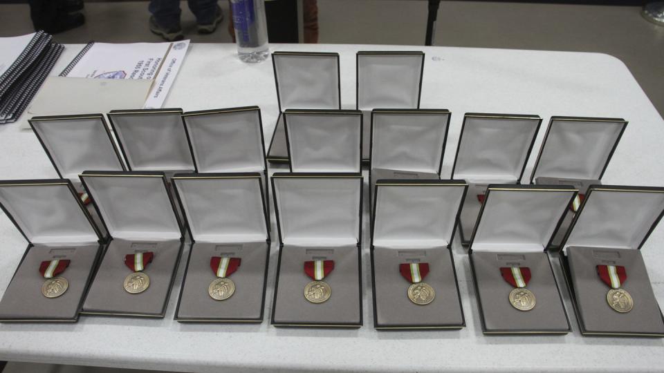 This March 28, 2023, photo shows 16 Alaska Heroism Medals prior to a ceremony in Gambell, Alaska, to honor 16 Alaska National Guard members. (Mark Thiessen/AP)