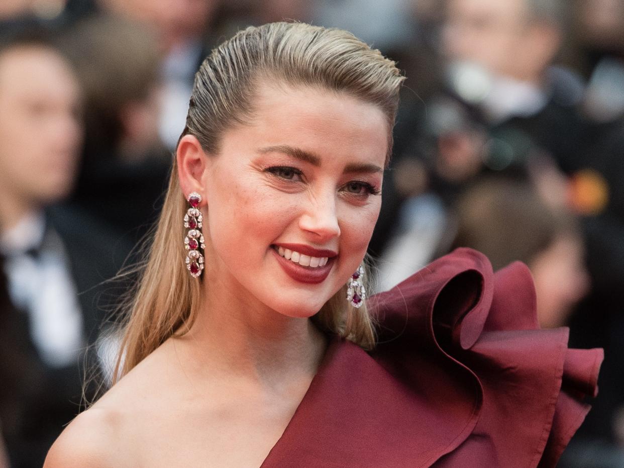 Amber Heard smiles on the red carpet during the screening of "Pain And Glory" at the 72nd annual Cannes Film Festival in 2019.