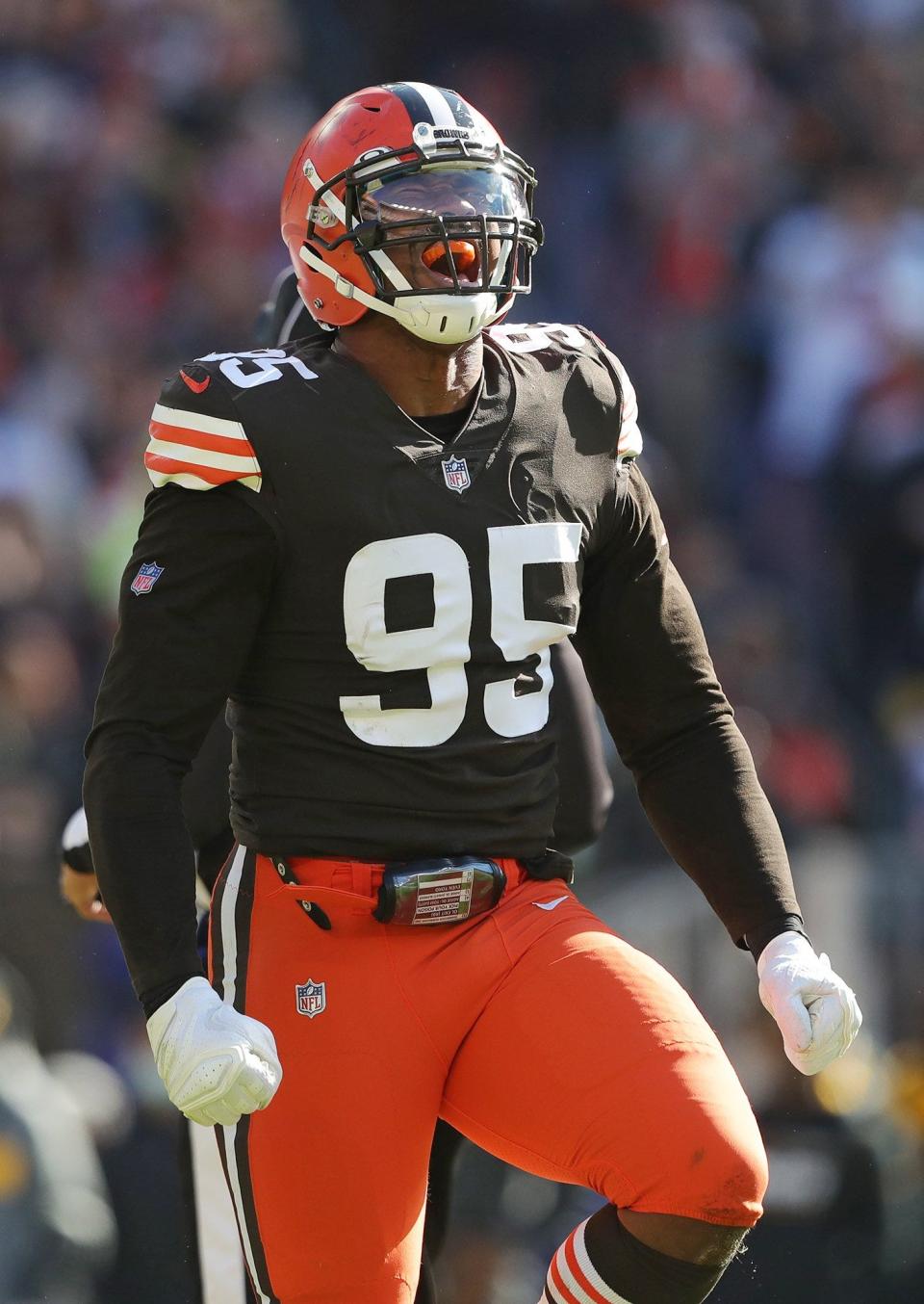 Cleveland Browns defensive end Myles Garrett (95) celebrates after sacking Pittsburgh Steelers quarterback Ben Roethlisberger (7) during the first half of an NFL football game, Sunday, Oct. 31, 2021, in Cleveland, Ohio. [Jeff Lange/Beacon Journal]