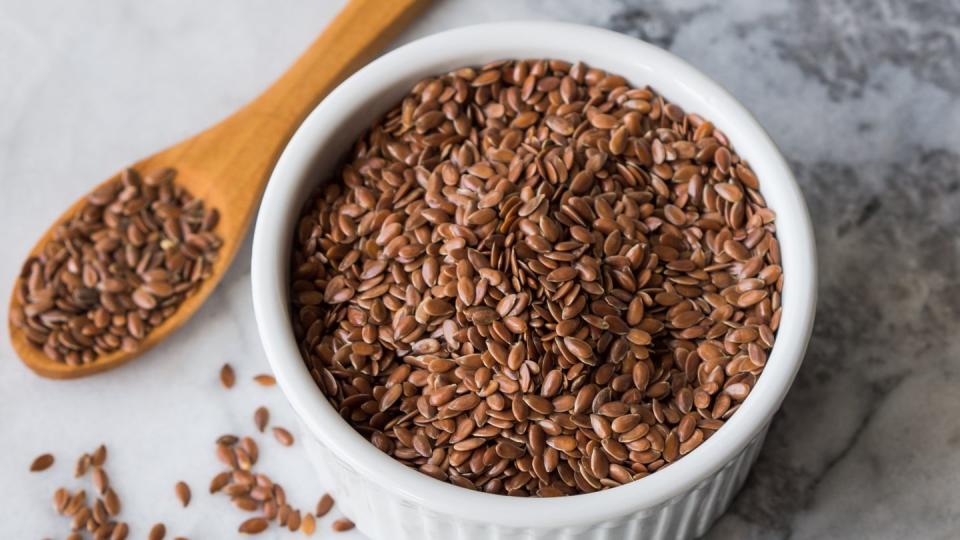 flax seeds in ramekin on marble board