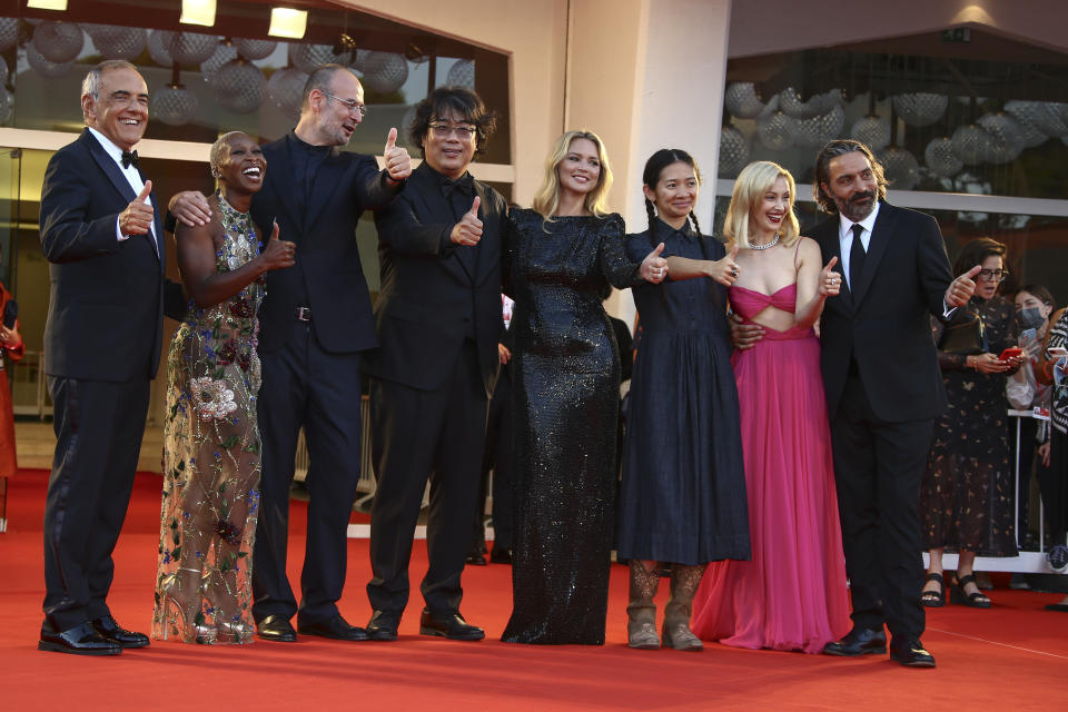 Director of the Venice film festival Alberto Barbera, from left, Jury members Cynthia Erivo, Alexander Nanau, Bong Joon Ho, JVirginie Efira, Chloe Zhao, Sarah Gadon and Saverio Costanzo pose for photographers upon arrival at the closing ceremony of the 78th edition of the Venice Film Festival in Venice, Italy, Saturday, Sept. 11, 2021. (Photo by Joel C Ryan/Invision/AP)