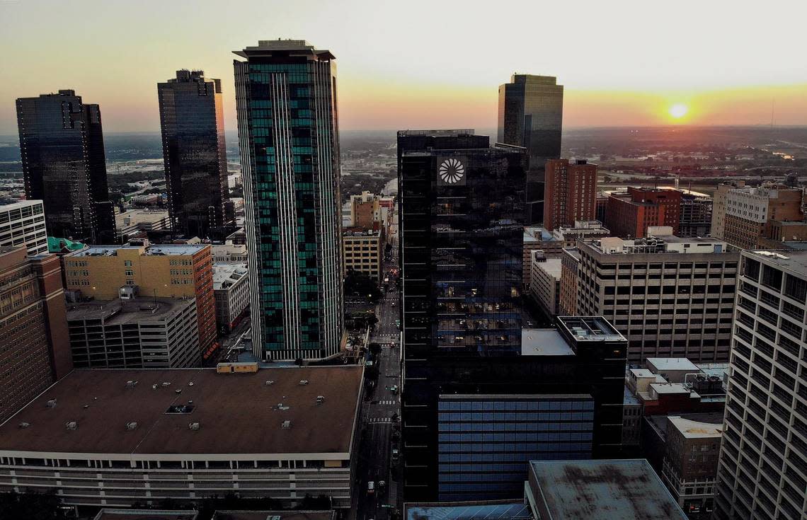 The sun rises behind downtown Fort Worth’s skyline on Friday, September 9, 2022.