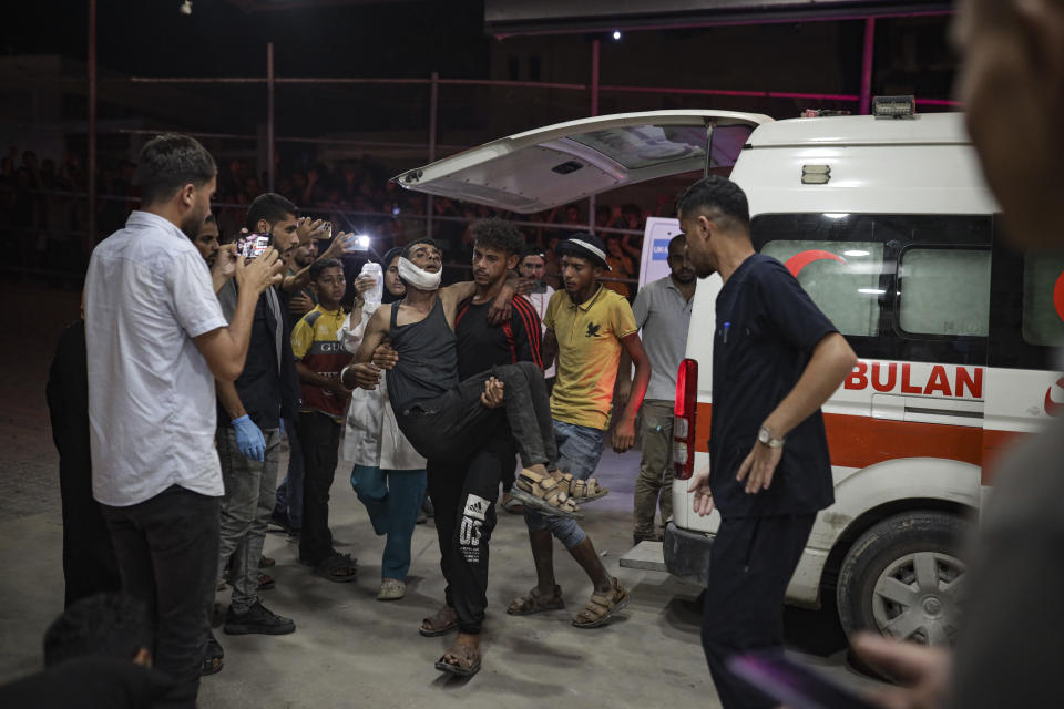 Palestinians wounded in Israeli bombardment of the Gaza Strip are brought to a hospital in Khan Younis, Thursday, June. 27, 2024. (AP Photo/Jehad Alshrafi)