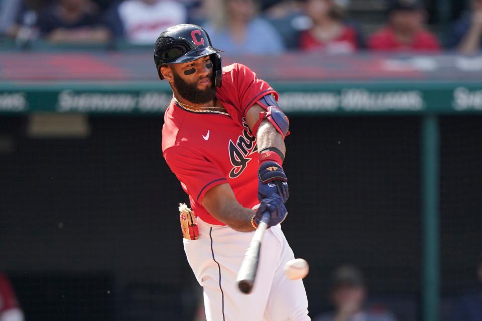 Cleveland's Amed Rosario hits an RBI-single in the sixth inning of a baseball game against the Kansas City Royals, Monday, Sept. 27, 2021, in Cleveland. (AP Photo/Tony Dejak)