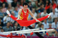 LONDON, ENGLAND - JULY 30: Weiyang Gao of China competes on the parallel bars in the Artistic Gymnastics Men's Team final on Day 3 of the London 2012 Olympic Games at North Greenwich Arena on July 30, 2012 in London, England. (Photo by Streeter Lecka/Getty Images)