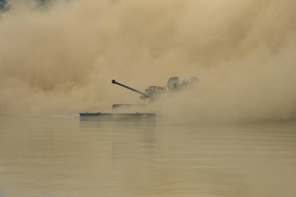 South Korea's K21 infantry fighting vehicle sails to shores in a smoke during the combined wet gap crossing military drill between South Korea and the United States as a part of the Ulchi Freedom Shield military exercise in Cheorwon, South Korea, Thursday, Aug. 31, 2023. (AP Photo/Lee Jin-man)