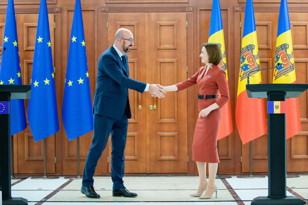 Charles Michel, the president of the European Council, shakes hands with Moldova’s president, Maia Sandu.