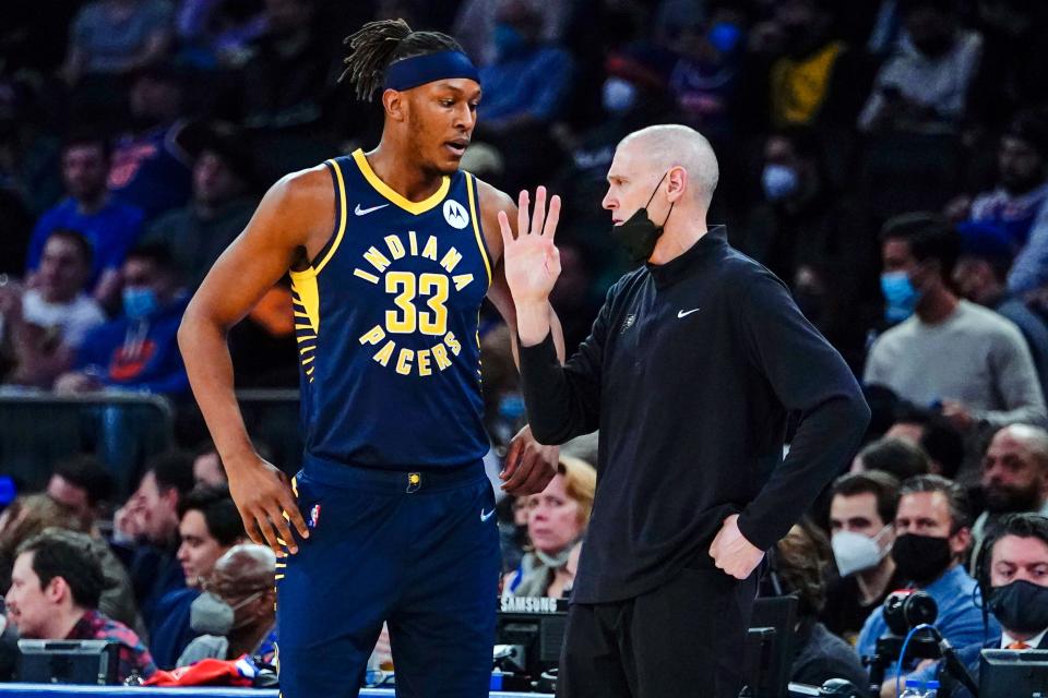 Indiana Pacers head coach Rick Carlisle, right, talks to Myles Turner (33) during the first half of an NBA basketball game against the New York Knicks, Tuesday, Jan. 4, 2022, in New York.