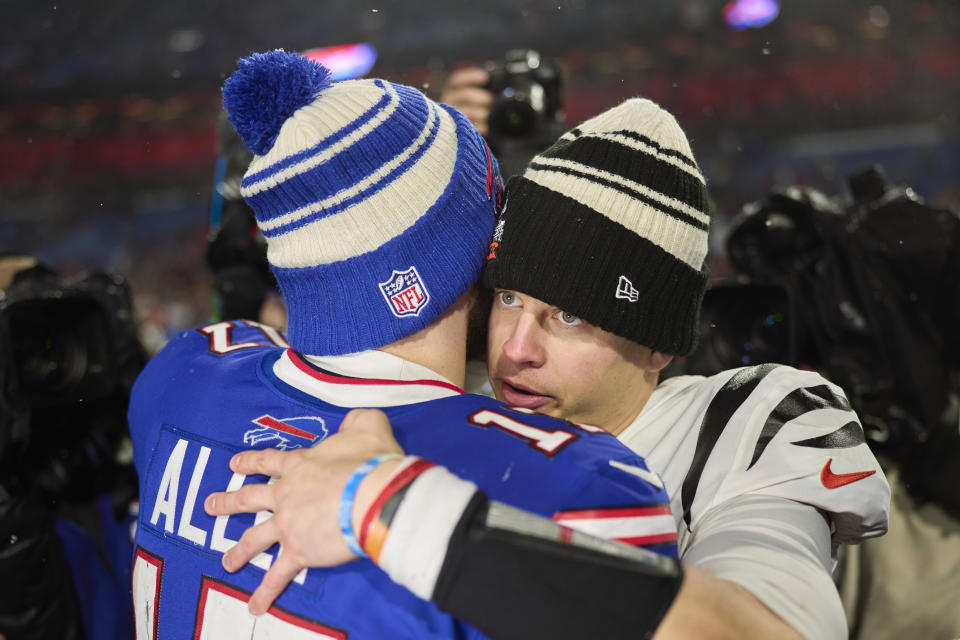 Joe Burrow #9 of the Cincinnati Bengals hugs Josh Allen #17 of the Buffalo Bills