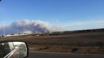 Vehicles are seen on highway 63 as they are detoured near wildfire burning near Fort McMurray, Alberta May 1, 2016. Courtesy Gregory Hong/Handout via REUTERS