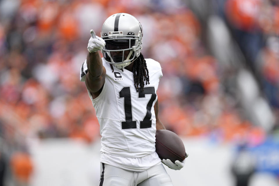 Las Vegas Raiders wide receiver Davante Adams (17) signals for a first down during the first half of an NFL football game against the Denver Broncos, Sunday, Sept. 10, 2023, in Denver. (AP Photo/David Zalubowski)