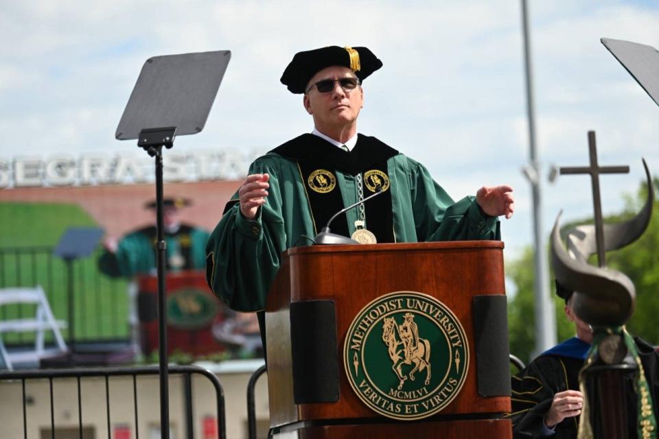 Methodist University President Stanley T. Wearden speaks at the school's graduation on May 7, 2022.