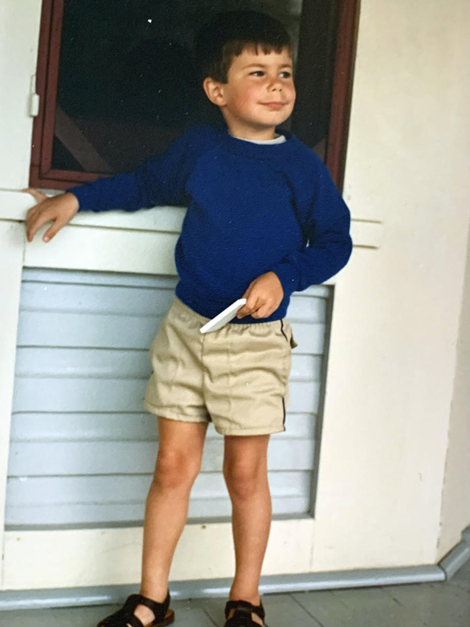 In this image provided by the Pete Buttigieg presidential campaign, Pete Buttigieg stands by a window during a family holiday around 1987 in Cape May, N.J. (Pete Buttigieg Presidential Campaign via AP)