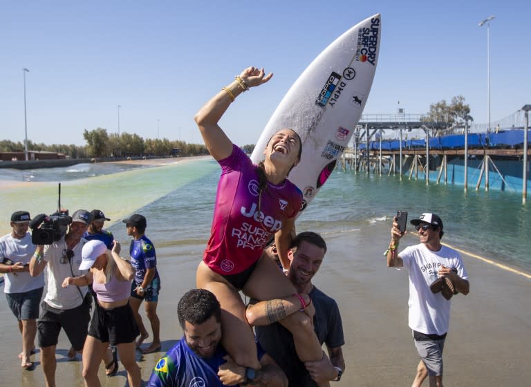 Johanne Defay of France gets a victory lift after she won the Jeep Surf Ranch Pro event June 20, 2021, in Lemoore, Calif.