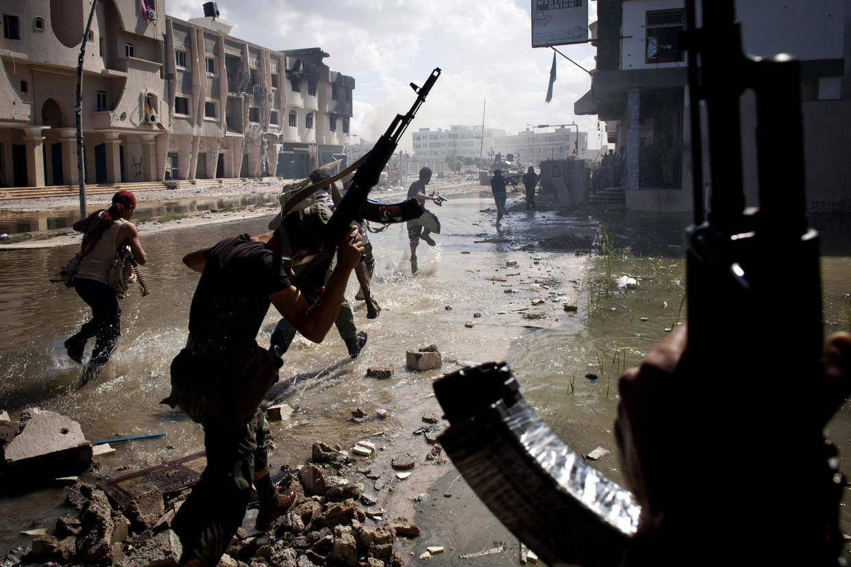 National Transitional Council fighters take part in a street battle in Sirte, Libya in the final assault on Gaddafi's hometown in 2011: Getty