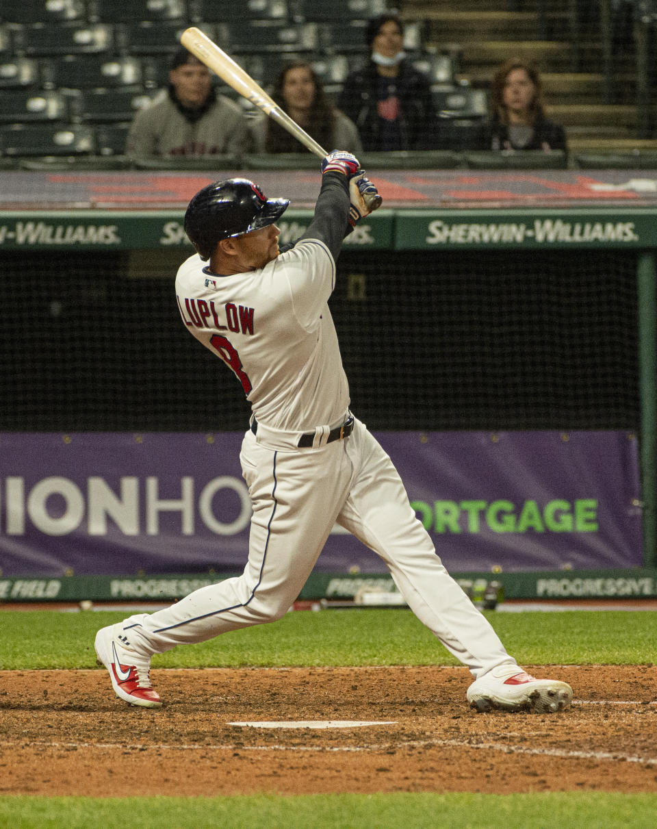 Cleveland Indians' Jordan Luplow watches his two-run home run off Minnesota Twins relief pitcher Alex Colome during the tenth inning of a baseball game in Cleveland, Monday, April 26, 2021. (AP Photo/Phil Long)