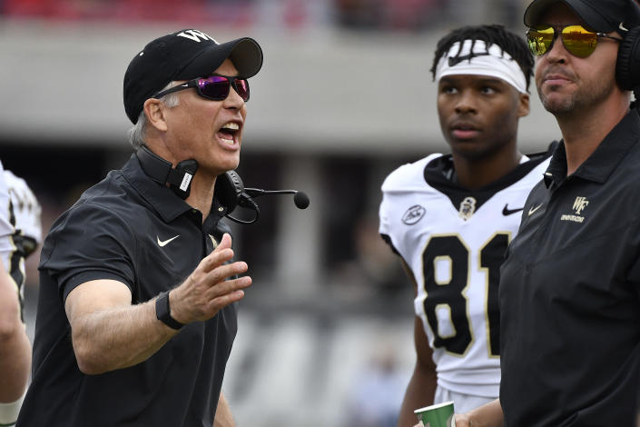 Wake Forest head coach Dave Clawson yells at his bench during the first half of an NCAA college football game against Louisville in Louisville, Ky., Saturday, Oct. 29, 2022. (AP Photo/Timothy D. Easley)
