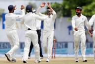 Cricket - Sri Lanka v India - First Test Match - Galle, Sri Lanka - July 29, 2017 - India's Ravindra Jadeja celebrates with teammates after taking the wicket of Sri Lanka's Angelo Mathews (not pictured). REUTERS/Dinuka Liyanawatte