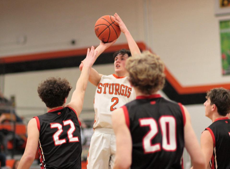 Carson Eicher pulls up from the free-throw line and hits a jumper against Vicksburg on Friday.