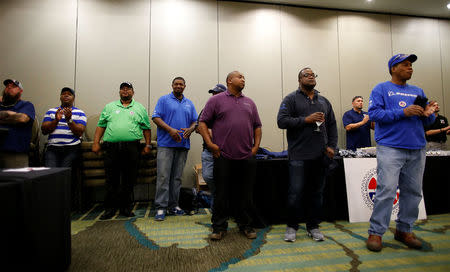 Workers listen at a rally held by The International Association of Machinists and Aerospace Workers for Boeing South Carolina workers before Wednesday's vote to organize, in North Charleston, South Carolina, U.S. February 13, 2017. REUTERS/Randall Hill