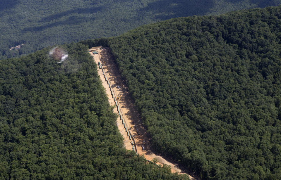FILE - This July 18, 2018, file photo, shows the Mountain Valley Pipeline route on Brush Mountain in Virginia. The Trump administration is seeking to fast track environmental reviews of the pipeline and dozens of other energy, highway and other infrastructure projects across the U.S. (Heather Rousseau/The Roanoke Times via AP, File)