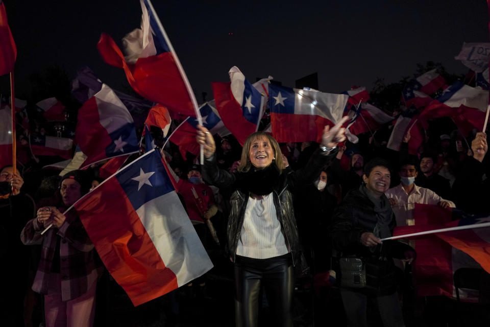 Demonstrators rally against the proposed new Constitution in Santiago, Chile, Thursday, Sept. 1, 2022. Chileans have until the Sept. 4 plebiscite to study the new draft and decide if it will replace the current Magna Carta imposed by a military dictatorship 41 years ago. (AP Photo/Matias Basualdo)