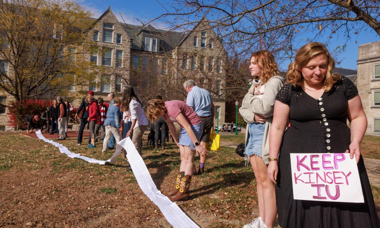 <span>Protesters unfurl a scroll with 5,500 petition signatures against a plan to separate the Kinsey Institute from Indiana University, in Bloomington, Indiana, on 8 November 2023.</span><span>Photograph: Jeremy Hogan/The Bloomingtonian/Alamy</span>