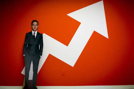 A cardboard cut-out of actor Ryan Gosling is seen in front of the company's logo at BuzzFeed's headquarters in the Midtown Manhattan in New York in this January 9, 2014 file photo. REUTERS/Brendan McDermid/Files