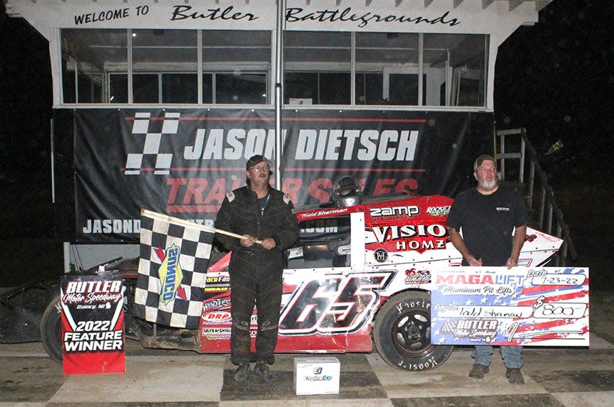 Todd Sherman stands proud in Victory Lane after taking the win in the UMP Modified Division Saturday