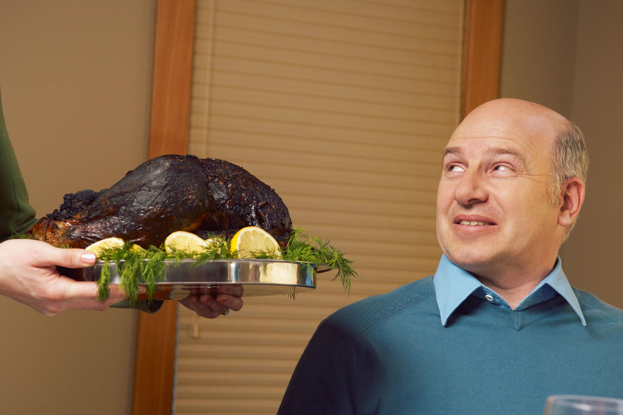 Man being served burnt turkey Getty Images/Beau Lark/Corbis/VCG