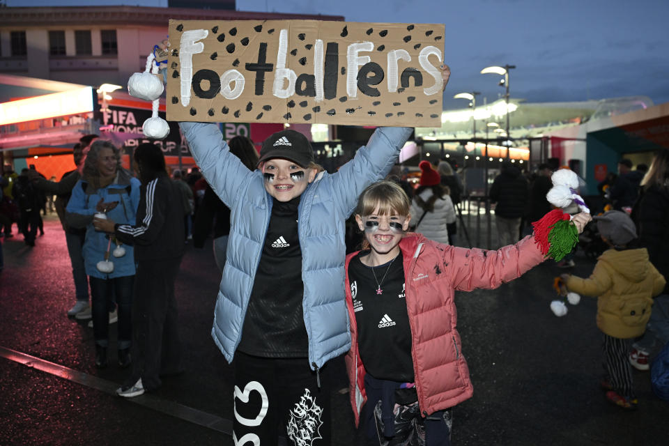 New Zealand supporters pose for a photos as they arrive at Eden Park for the Women's World Cup soccer match between New Zealand and Norway in Auckland, New Zealand, Thursday, July 20, 2023. (AP Photo/Andrew Cornaga)