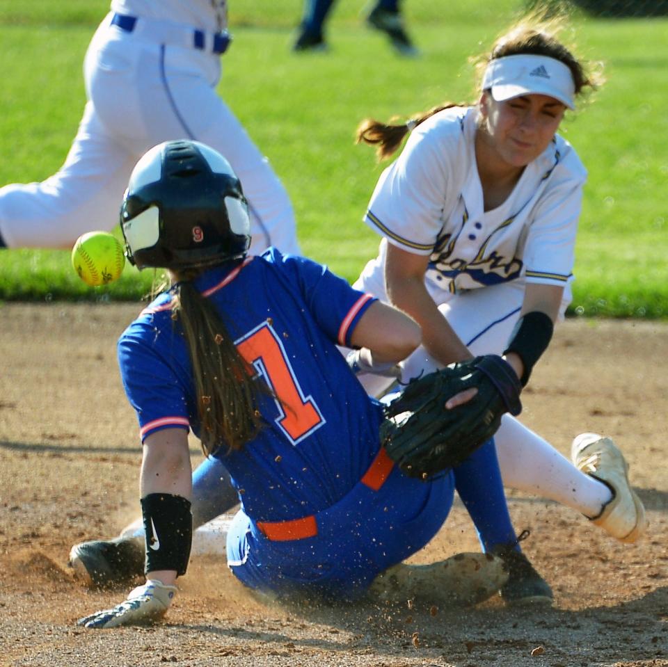 Boonsboro's Emmalee Burker (7) slides into Clear Spring second baseman Dana Hammond before the ball reaches the bag at the start of a 10-run fourth inning that paced the Warriors to a 14-0 win over Clear Spring in the 1A West Region II semifinals.