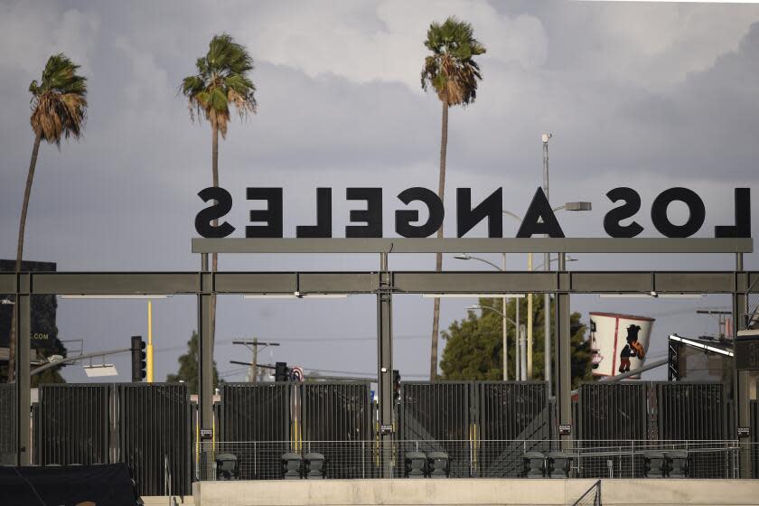 The gates for Banc of California remain closed before an MLS soccer match between Los Angeles FC and the Portland Timbers in Los Angeles, Sunday, Nov. 8, 2020. (AP Photo/Kelvin Kuo)