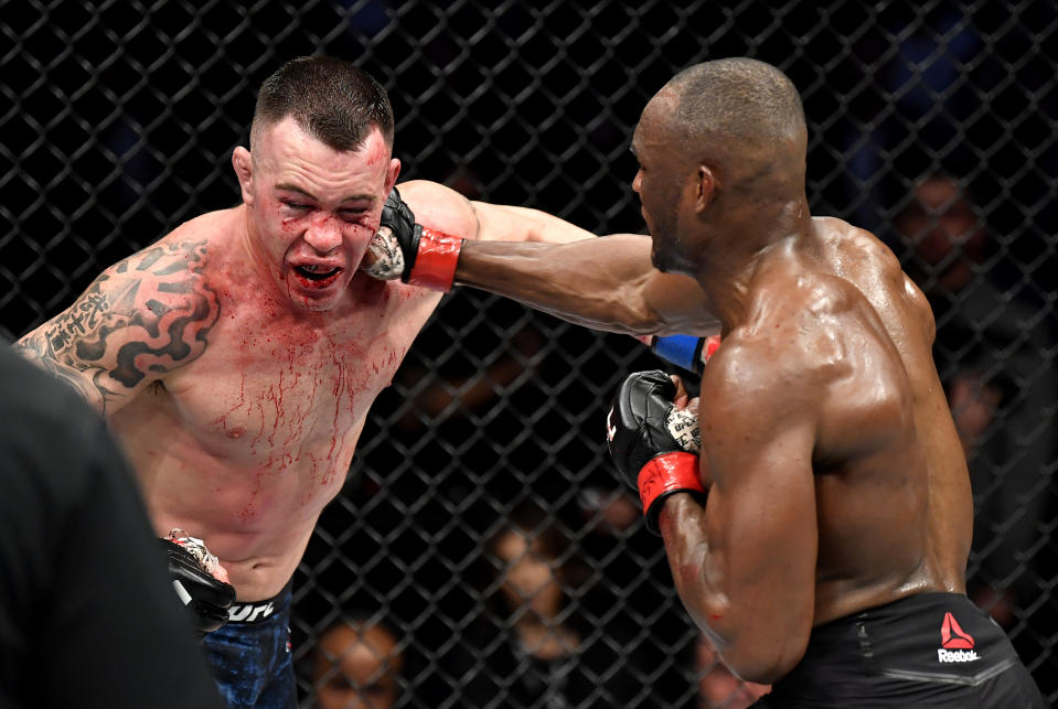 LAS VEGAS, NEVADA - DECEMBER 14:  (R-L) Kamaru Usman of Nigeria punches Colby Covington in their UFC welterweight championship bout during the UFC 245 event at T-Mobile Arena on December 14, 2019 in Las Vegas, Nevada. (Photo by Jeff Bottari/Zuffa LLC via Getty Images)