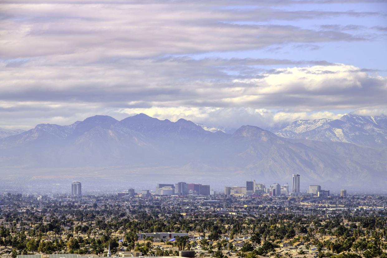 Las Vegas downtown(old town) buildings with Mt Charleston in the background with winter snow on top.