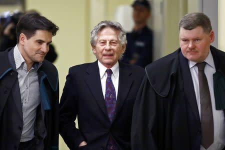 Filmmaker Roman Polanski (C) arrives for a court hearing in Krakow February 25, 2015. REUTERS/Kacper Pempel