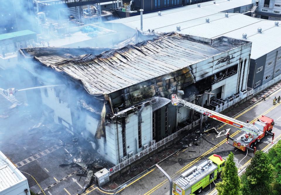 Firefighters work at the site of a burnt lithium battery manufacturing factory in Hwaseong (AP)