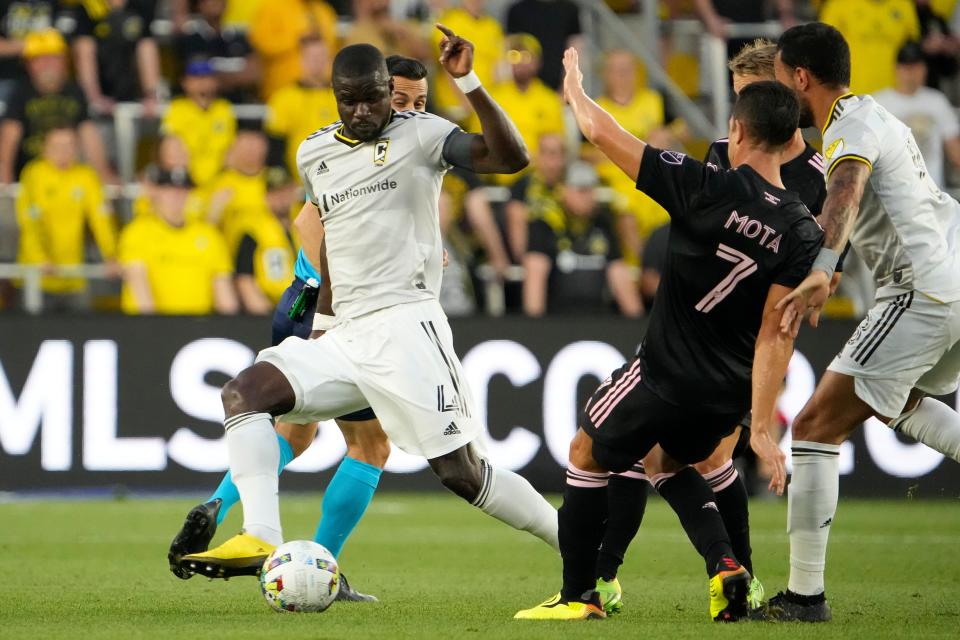 Aug 31, 2022; Columbus, Ohio, USA; Columbus Crew defender Jonathan Mensah (4) stops a shot from Inter Miami midfielder Jean Mota (7)  during the first half of the MLS game at Lower.com Field. Mandatory Credit: Adam Cairns-The Columbus Dispatch