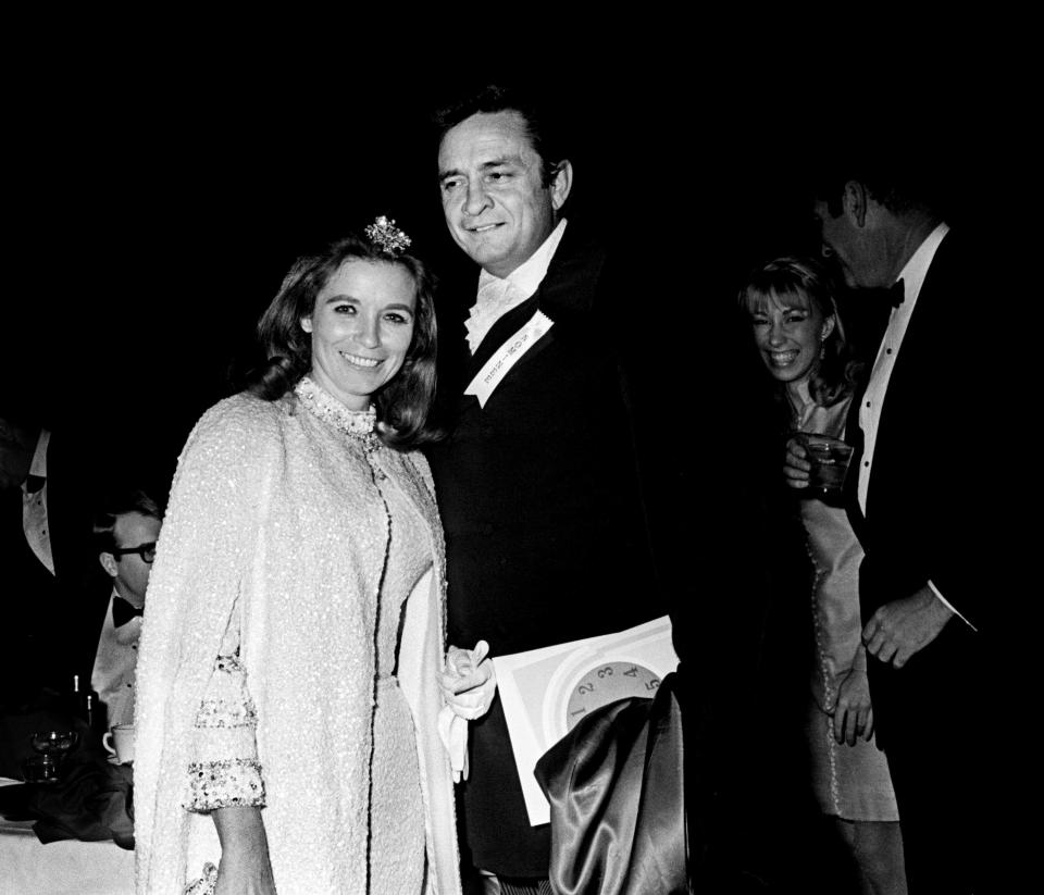 Country music star Johnny Cash and June Carter Cash arrive for the 11th annual Grammy Award show at the National Guard Armory in Nashville March 12, 1969. The awards were presented simultaneously at banquets in New York, Chicago, Los Angeles and Nashville.