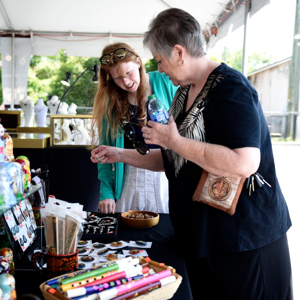 Maggie McBurney (left) and Sandi Savell shop during the first day of the Augusta Greek Festival at Holy Trinity Greek Orthodox Church on Telfair Street on Friday, April 29, 2022.