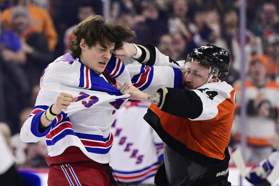 Philadelphia Flyers' Nicolas Deslauriers (44) and New York Rangers' Matt Rempe (73) fight during the first period of an NHL hockey game, Saturday, Feb. 24, 2024, in Philadelphia. (AP Photo/Derik Hamilton)