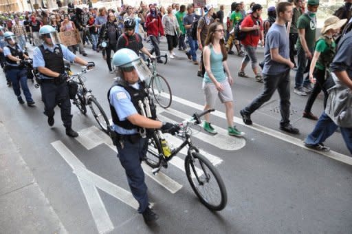 Demonstrators with Occupy Chicago march through the streets in Chicago, Illinois on May 18, escorted by local police ahead of the NATO 2012 Summit. Three NATO summit activists suspected of planning to throw Molotov cocktails during protests in Chicago face terrorism charges, their lawyers said Saturday