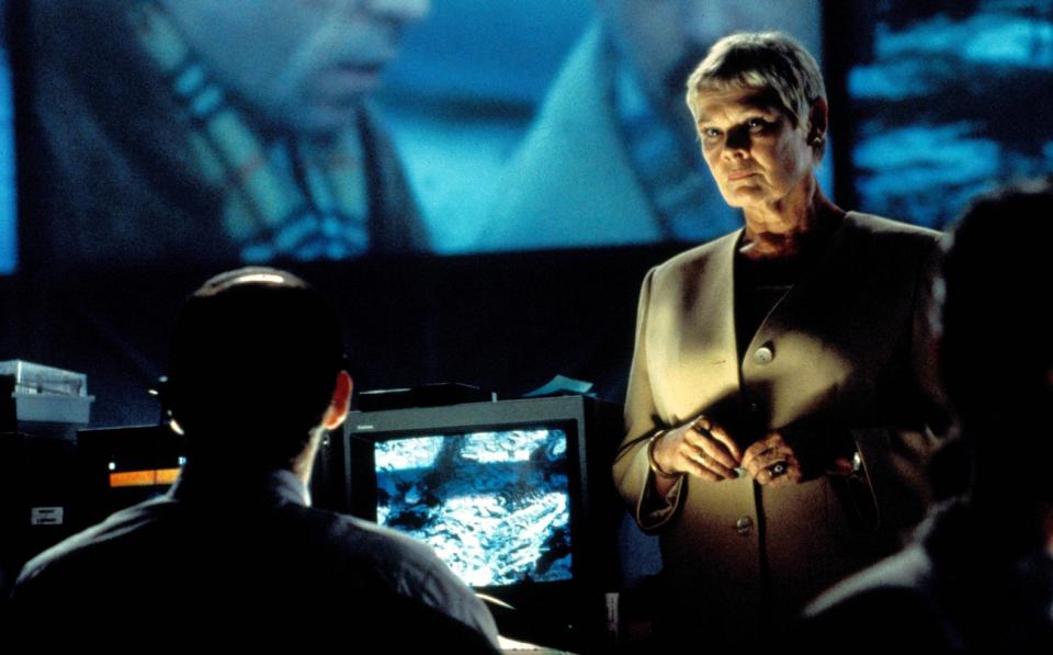 Judi Dench as M in Tomorrow Never Dies, her second Bond film - Moviestore/Shutterstock