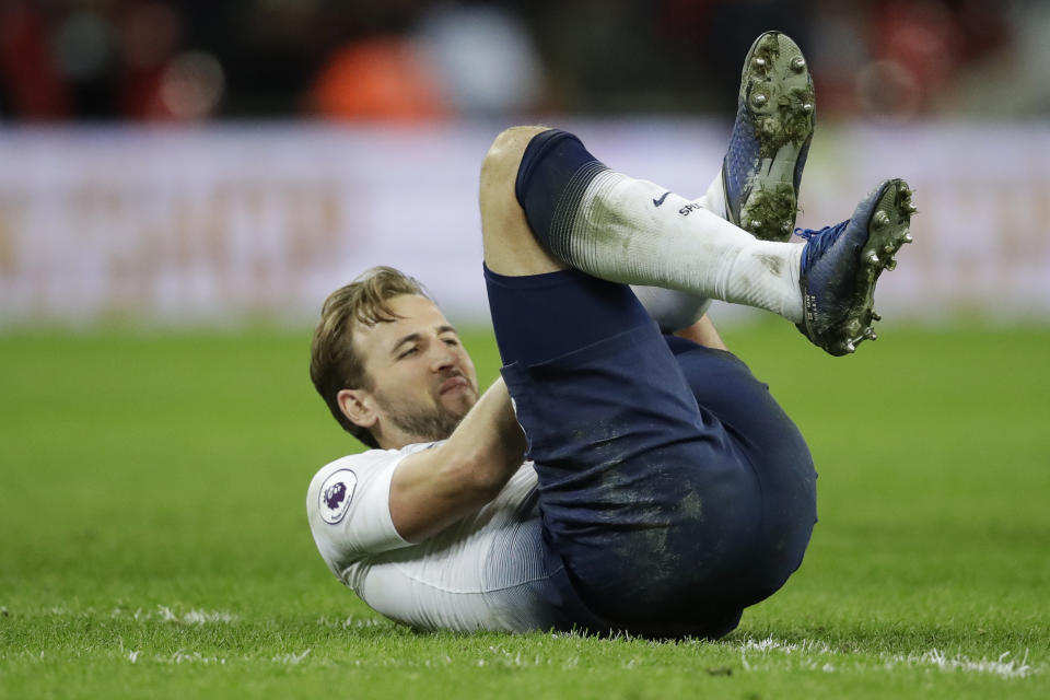 Tottenham's Harry Kane lies on the pitch with an injury after the English Premier League soccer match between Tottenham Hotspur and Manchester United at Wembley stadium in London, England, Sunday, Jan. 13, 2019. (AP Photo/Matt Dunham)