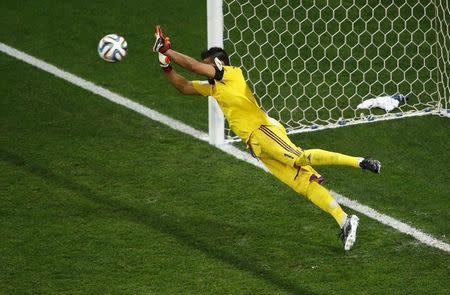 Argentina's goalkeeper Sergio Romero saves a shot by Wesley Sneijder of the Netherlands during a penalty shootout in their 2014 World Cup semi-finals at the Corinthians arena in Sao Paulo July 9, 2014. REUTERS/Ricardo Moraes