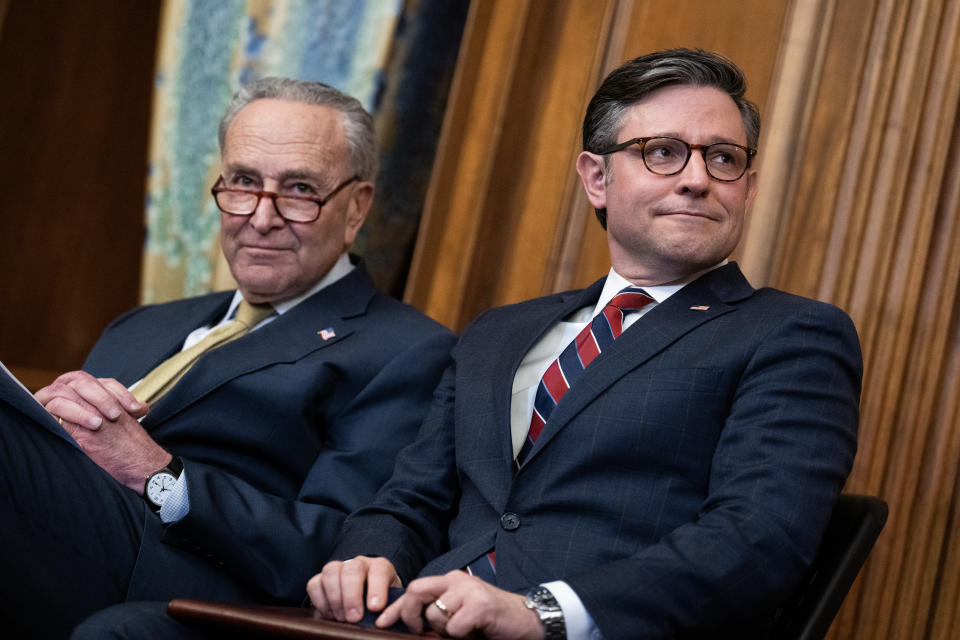 Senate Majority Leader Charles Schumer (D-N.Y.) with Speaker of the House Mike Johnson (R-La.) on Dec. 12. (Tom Williams/CQ-Roll Call, Inc via Getty Images)