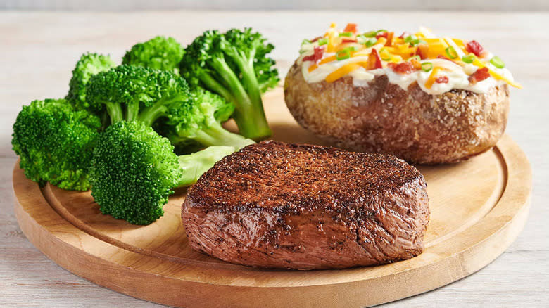 Sirloin steak with baked potato and broccoli