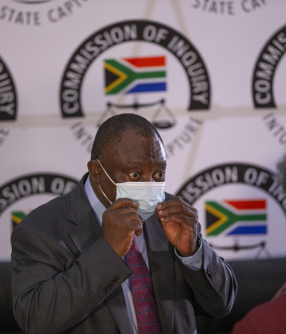 South African President Cyril Ramaphosa appears on behalf of the ruling African National Congress party at the Zondo Commission of Inquiry into state corruption in Johannesburg, South Africa, Thursday, April 29, 2021. Ramaphosa says rampant corruption has seriously damaged South Africa’s economy and people’s trust in the government. (Kim Ludbrook/Pool via AP)