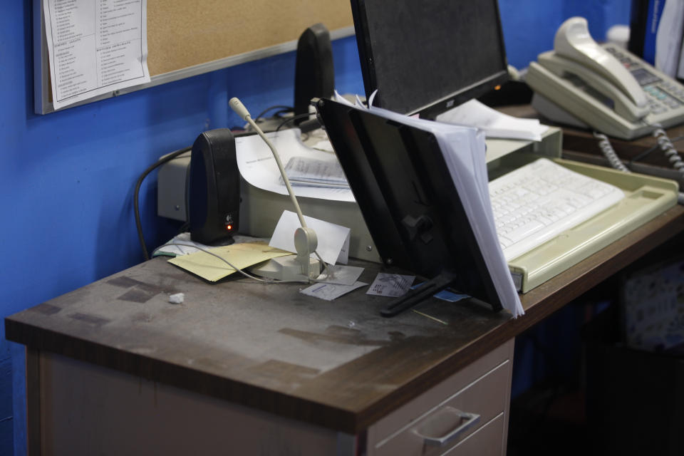 An empty spot on reporter Phyllis Zorn's desk shows where her computer tower sat before law enforcement officers seized it.