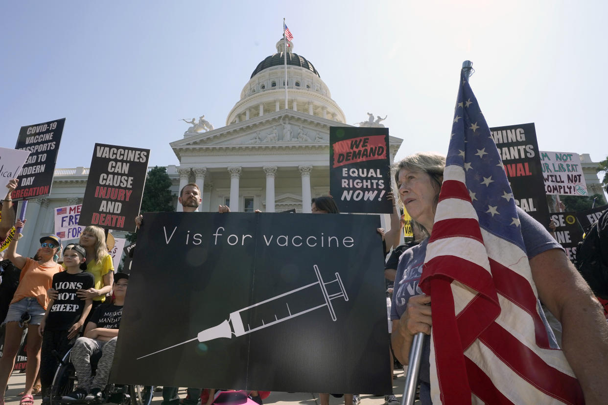 FILE — Protesters opposing vaccine mandates gather at the Capitol in Sacramento, Calif., Sept. 8, 2021. A bill that would have allowed teens age 15 and up to get the coronavirus vaccine without parental consent will not pass the Legislature, state Sen. Scott Wiener announced, Wednesday, Aug. 31, 2022. Wiener, the bill's author, said it didn't have enough support to clear the state Assembly. (AP Photo/Rich Pedroncelli, File)